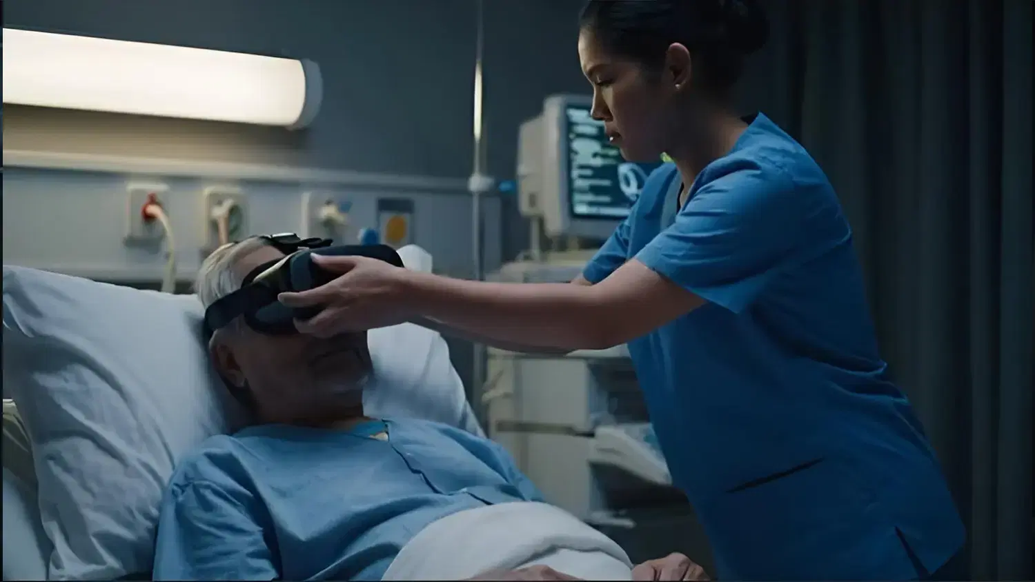 Nurse placing a VR headset on a patient in a hospital bed