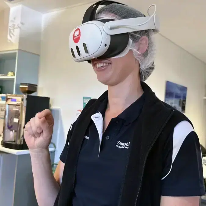 Patient using a VR headset in a hospital setting